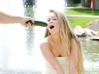 Madison plays outside with a cucumber