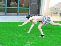 Leila does cartwheels topless outside