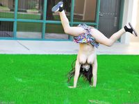 Leila does cartwheels topless outside