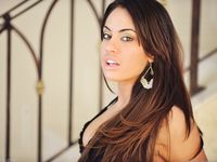 Shana plays with her pussy on the stairs