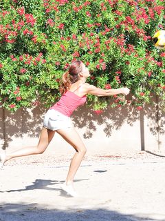 Valerie plays naked in a park